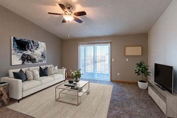 Fargo apartment for rent - an open living room with a couch and a tv