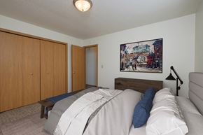 Fargo apartment for rent - Fargo, ND Twin Parks Apartments. a bedroom with a bed and a chair in a room