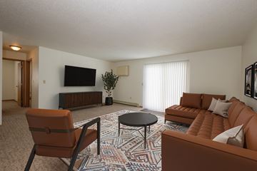 Fargo apartment for rent - a living room with a couch and a table