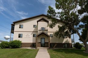 Fargo apartment for rent - Fargo, ND Village Park Apartments. An image of the front of a large building with a water tower in the background