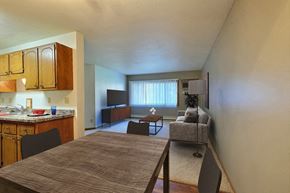 Fargo apartment for rent - Fargo, ND Westcourt Apartments.  a kitchen and living room with a table and chairs