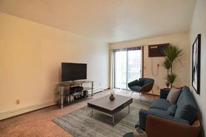 Fargo apartment for rent - a living room with a couch coffee table and tv. Fargo, ND Westwood Estates Apartments