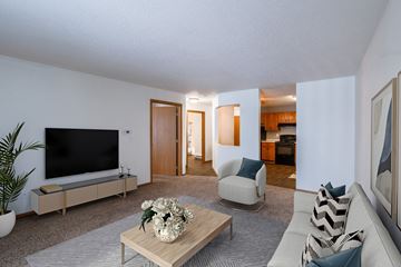 Fargo apartment for rent - a living room with a couch and a coffee table and a television