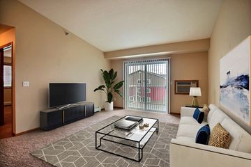 Fargo apartment for rent - a living room with a couch and a coffee table