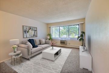 Fargo apartment for rent - Fargo, ND Woodland Apartments. a living room with a couch coffee table and a window