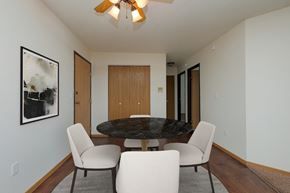 Moorhead apartment for rent - a dining room with a table and chairs. Moorhead, MN Woodstone Apartments