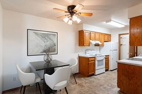 Fargo apartment for rent - a kitchen and dining room with a table and chairs. Fargo, ND Brownstone Apartments
