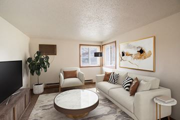 Fargo apartment for rent - a living room with a white couch and a coffee table