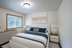 Fargo apartment for rent - a bedroom with a bed and two night stands and a window. Fargo, ND Crown Court 1 Apartments