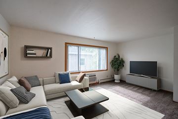 Fargo apartment for rent - a living room with a couch and a tv