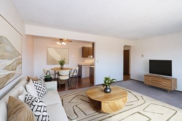 Fargo apartment for rent - a living room with a couch and a table and a tv