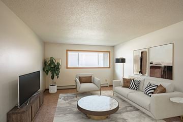 Fargo apartment for rent - a living room with a couch and a coffee table and a tv
