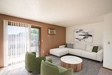 Fargo apartment for rent - a living room with a couch and chairs and a table