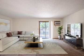 Fargo apartment for rent - a living room with a white couch and a coffee table