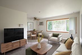 Fargo apartment for rent - a living room with a couch a chair a table and a television. Fargo, ND Luxford Apartments