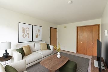 Fargo apartment for rent - a living room with a couch and a coffee table