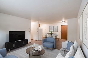 Fargo apartment for rent - a living room with a couch and a table and a tv. Fargo, ND Monticello Apartments