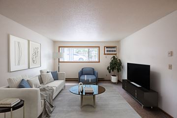 Fargo apartment for rent - a living room with a couch and a table and a tv