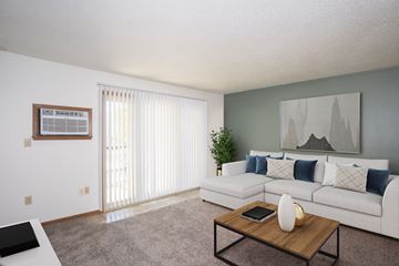 Fargo apartment for rent - a living room with a white couch and a coffee table