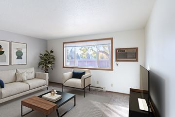 Fargo apartment for rent - a living room with a couch and a table and a window