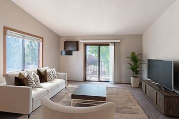 Fargo apartment for rent - a living room with a couch and a coffee table and a tv