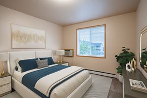 West Fargo apartment for rent - a bedroom with a bed and a window. Fargo, ND West Lake Apartments