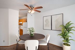 Fargo apartment for rent - a dining room with a table and chairs and a ceiling fan. Fargo, ND Westview Towers Apartments