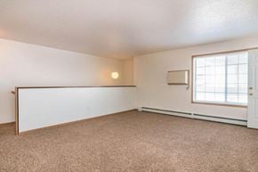 Fargo townhouse for rent - an living room with a window and a white wall. Fargo, ND Foxtail Townhomes