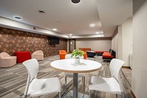 Fridley apartment for rent - a meeting room with a round table and chairs. Fridley, MN Georgetown on the River Apartments