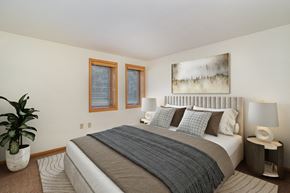 Golden Valley apartment for rent - a bedroom with a bed, night stands, and two small windows. Golden Valley, MN Valley View Apartments | 11B | Bedroom