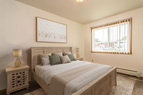Grand Forks triplex for rent - Grand Forks, ND Amberwood Apartments a bedroom with a large bed and windows