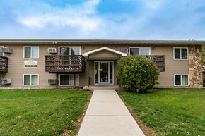 Grand Forks townhouse for rent - Grand Forks, ND Autumn Apartments. The exterior of a two level apartment building.