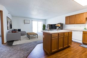 Grand Forks townhouse for rent - Grand Forks, ND Autumn Ridge. a kitchen and living room with a couch and coffee table