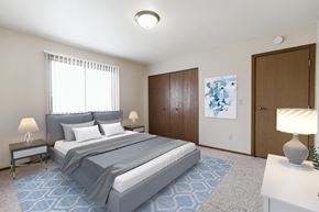 Grand Forks apartment for rent - Grand Forks, ND Carling Manor Apartments.  a bedroom with a bed and two nightstands