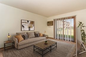 Grand Forks apartment for rent - Grand Forks, ND Chandler 1866 Apartments. a living room with a couch and a coffee table