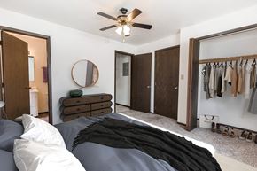 Grand Forks apartment for rent - Grand Forks, ND Claremont Apartments a bedroom with a large closet and a ceiling fan