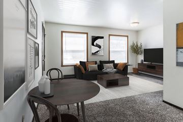 Grand Forks apartment for rent - a living room with a table and a couch and a tv
