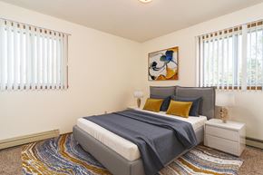 Grand Forks apartment for rent - Grand Forks, ND Grandview I Apartments. a bedroom with a bed and two windows
