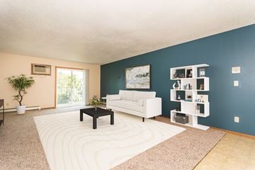 Grand Forks apartment for rent - a living room with a white couch and a coffee table