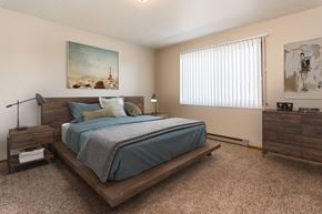 Grand Forks apartment for rent - Grand Forks Kremer Apartments. A bedroom with a large window, a bed, and night stands