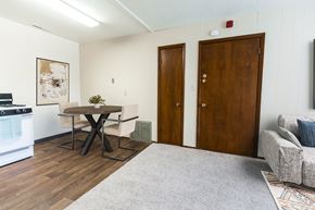 Grand Forks apartment for rent - Grand Forks, ND Louise Apartments. a dining room with a table with 2 chairs.