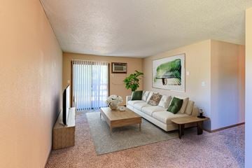 Grand Forks apartment for rent - a living room with a white couch and a coffee table