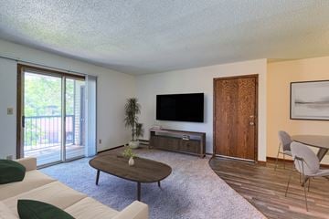 Grand Forks apartment for rent - a living room with a couch and a table and a television