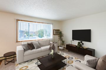 Grand Forks apartment for rent - the living room of an apartment with a white couch and a television