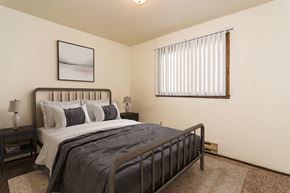 Grand Forks apartment for rent - Grand Forks, ND Stanford Court Apartments  a bedroom with a bed and a window