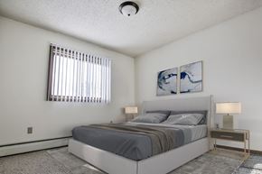 Grand Forks apartment for rent - .  Grand Forks, ND Sunview apartments.  a bedroom with a bed and two night stands with a window