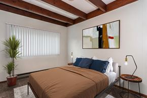 Grand Forks apartment for rent - Grand Forks, ND Washington Apartments. a bedroom with a bed and a large painting on the wall