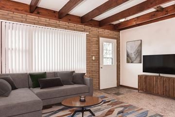 Grand Forks apartment for rent - a living room with a couch and a coffee table and a television