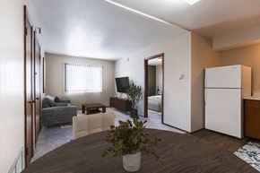 Grand Forks apartment for rent - a living room with a dining room table and a kitchen