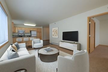 Moorhead apartment for rent - a living room with couches and chairs and a television